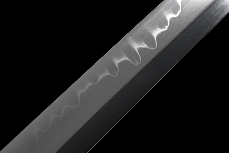 An alternate angle showing the beautiful wave pattern of the clay-tempered hamon on the blade.