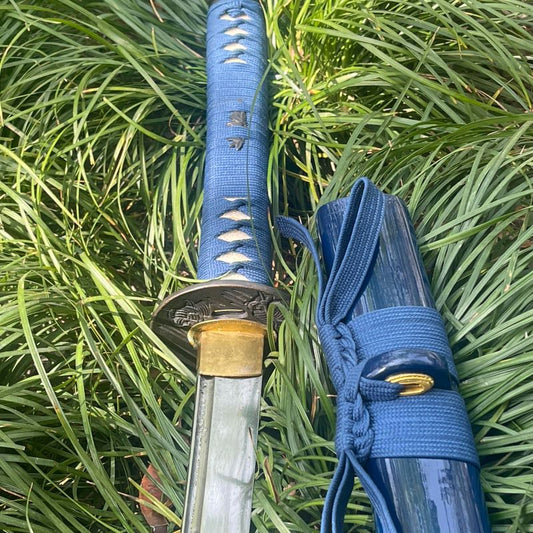 A close-up of the Abyss Fang Katana's handle and the upper part of its deep-blue gloss lacquer saya.