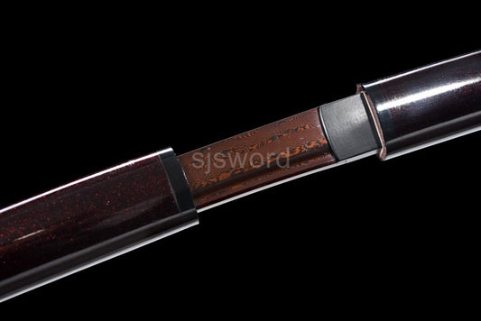 A close-up of the joint between the handle and saya of the Aurora Steel Red Shirasaya.