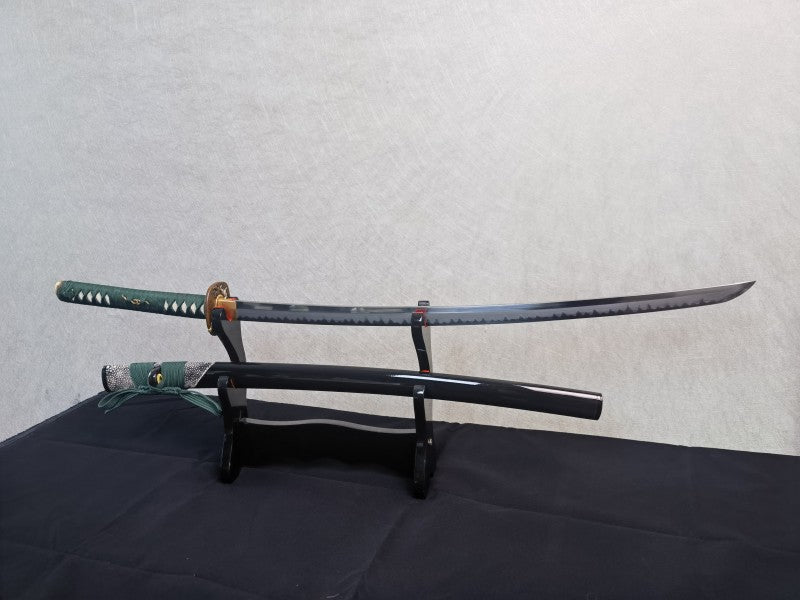 A full view of the T10 steel blade, showcasing the entire length of the real clay-tempered hamon.