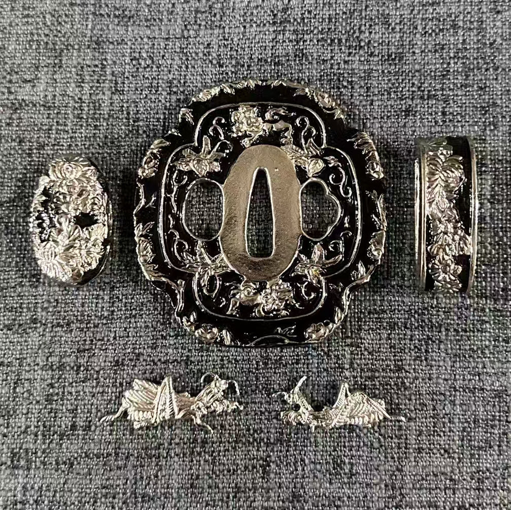 Complete Koshirae set featuring silver-gilded crickets (Menuki) and floral vines on a blackened brass Tsuba, Fuchi, and Kashira.