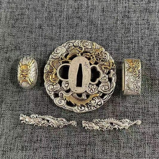 Gilded and silvered brass Koshirae set, featuring a Hannya mask on the Kashira and golden dragons in silver clouds on the Tsuba, Fuchi, and Menuki.