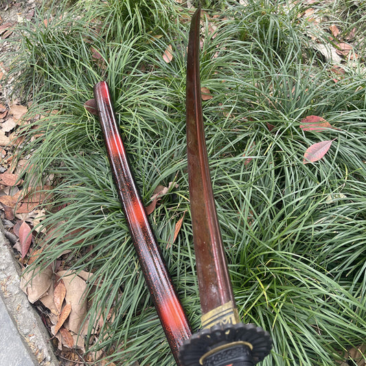 An alternate angle of the unsheathed Inferno Blade Katana, showing the unique color of the folded steel.