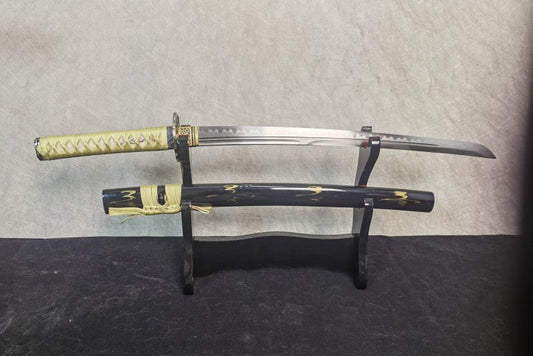 The Lightning Vein Wakizashi, fully sheathed in its gloss-black saya featuring a gold lightning motif.