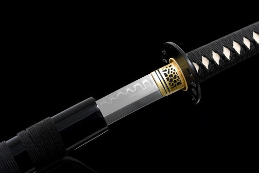 A close-up of the unique honeycomb pattern brass habaki on the Kill Bill katana replica by Hattori Hanzō.
