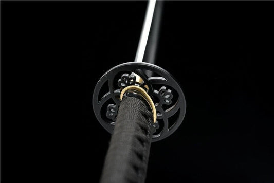 An alternate angle of the plum blossom tsuba and the black silk ito wrap on the tsuka handle.