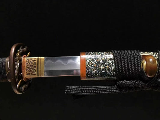 A close-up of the hardwood saya, featuring the beautiful Raden (mother-of-pearl inlay) finish.