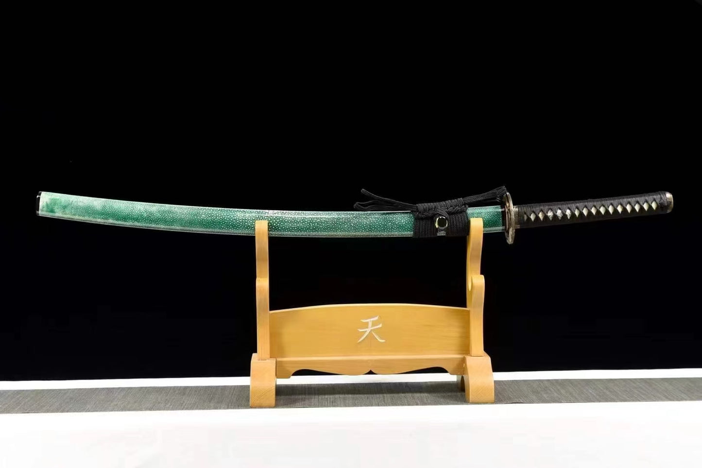 The complete Jade Tiger Katana, sheathed in its green rayskin saya, resting on a display stand.