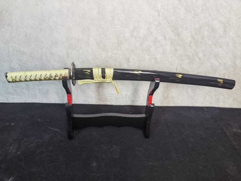 The complete, sheathed Lightning Vein Wakizashi displayed on a stand against a light, textured background.