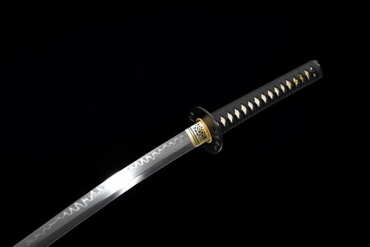 A view of the upper part of the T10 steel blade and the black lacquered saya of the Hattori Hanzō sword.