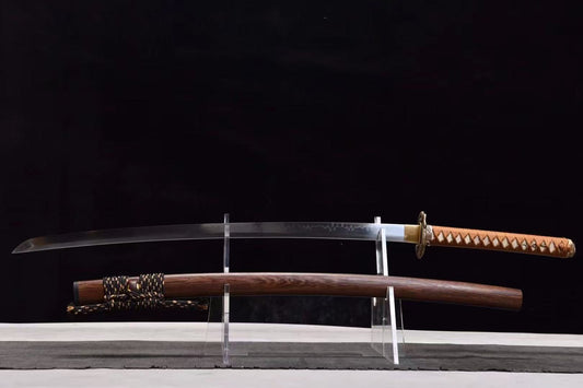 The Orochi's Coil Katana, featuring a T10 steel blade and sculpted serpent tsuba, on a display stand.