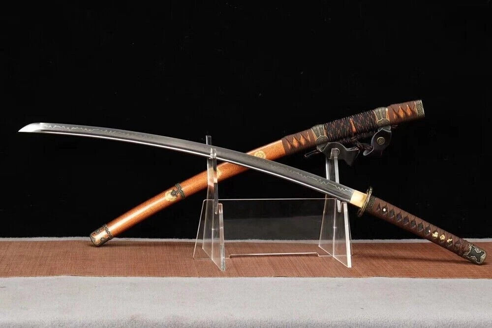 A full view of the Shogun's Golden Tachi and saya, displaying the entire T10 steel clay-tempered blade.