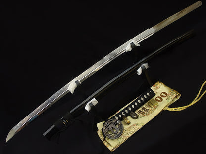 The unsheathed Sage's Journey Katana and its gloss-black saya displayed together on a stand.