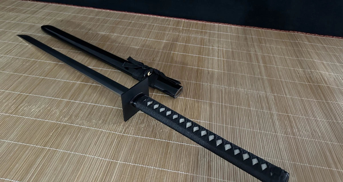 The Obsidian Gale Ninja Sword and its saya crossed, displaying the full profile of the straight blade and fittings.
