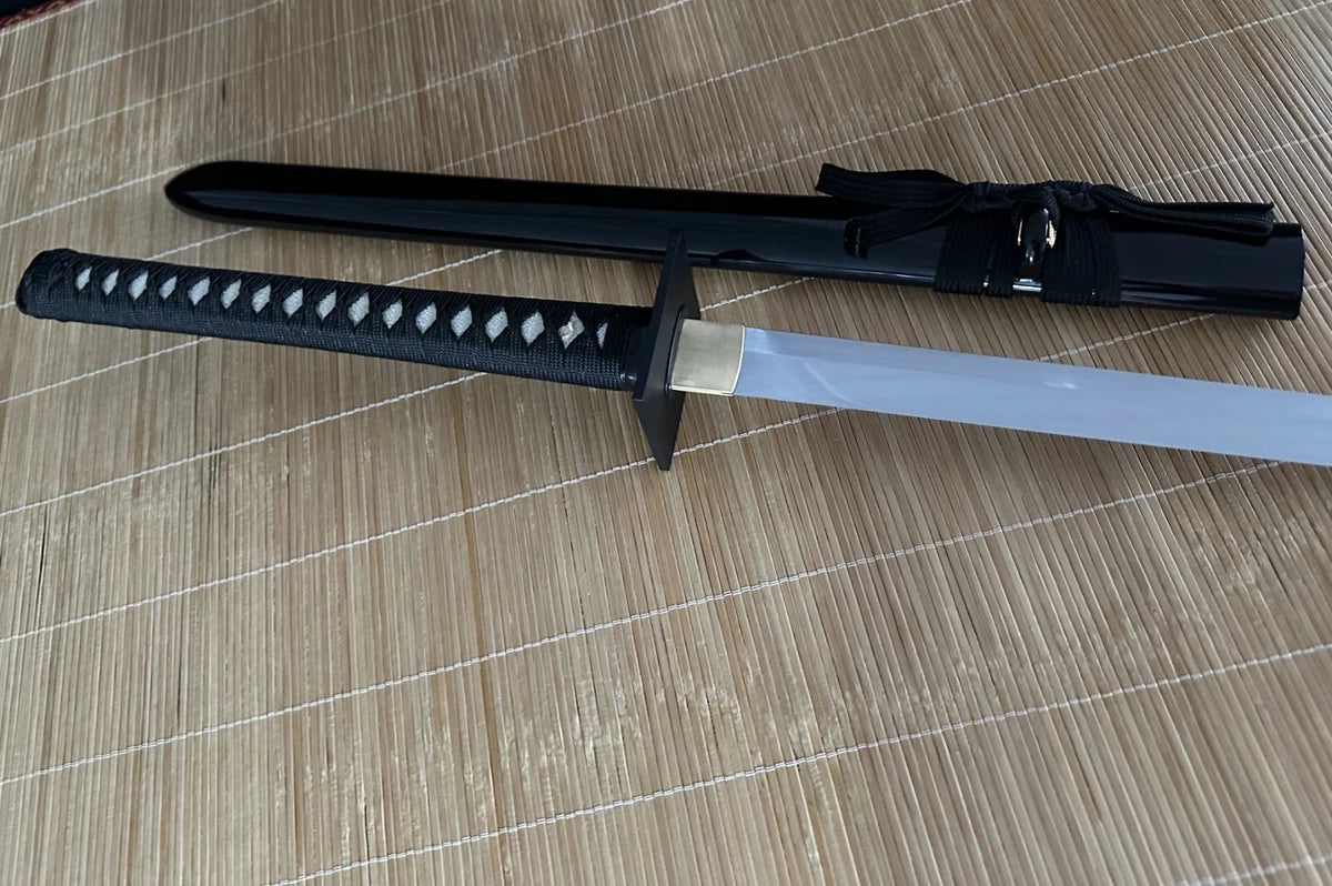 An alternate full-length view of the through-hardened 9260 spring steel blade and its matching saya.