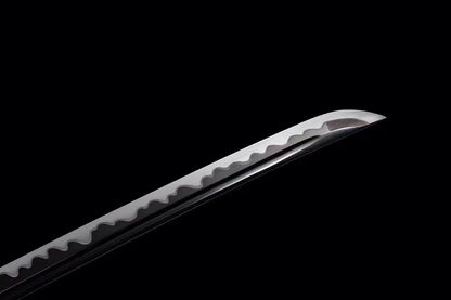 A close-up of the T10 steel blade, clearly showing the authentic and active Aesthetic hamon line.