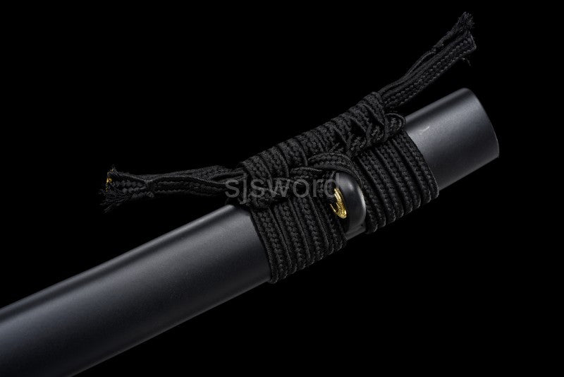 A close-up of the black sageo cord tied onto the kurikata of the black lacquered saya.