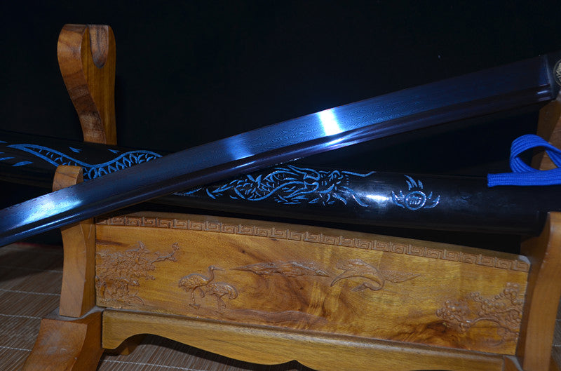 An alternate angle of the unsheathed Seiryu's Blade, focusing on the unique blue hue of the folded steel blade.