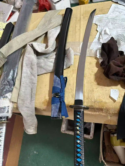 Full view of the custom blue wolf katana — saya, blade and wrapped handle