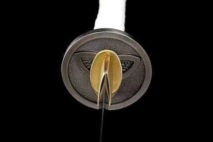 A view looking down the triple-crescent tsuba towards the brass habaki and the 1095 steel blade.