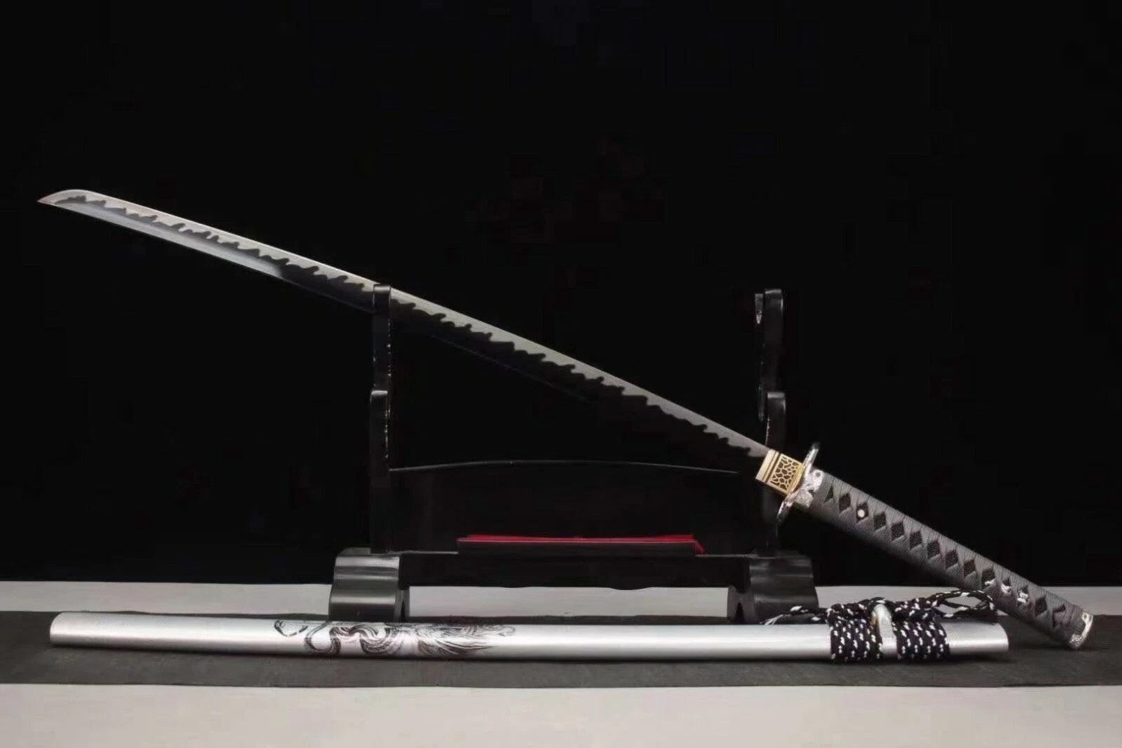 An alternate angle of the unsheathed Silver Dragon Katana, with the silver dragon saya in the foreground.