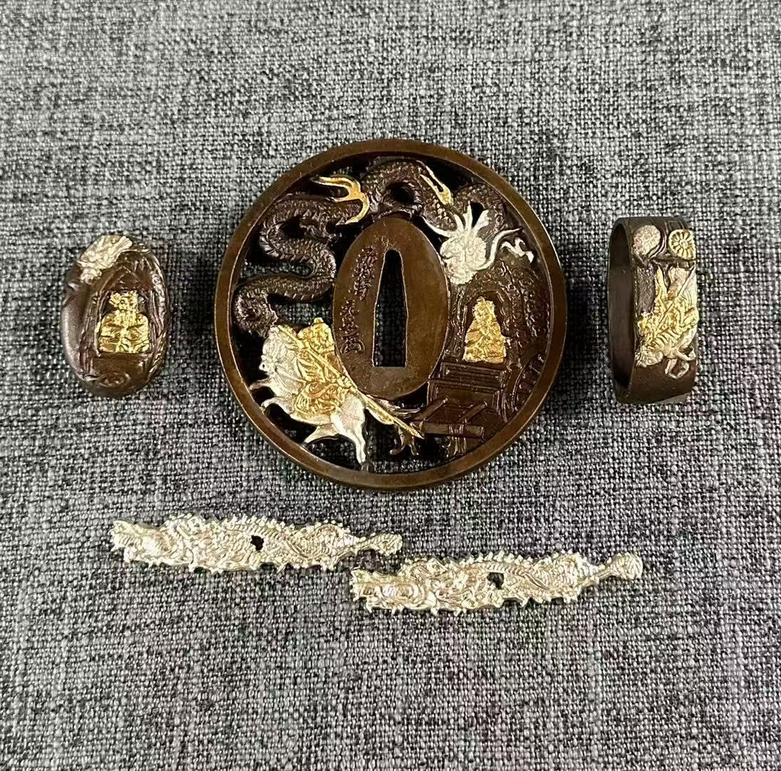 Dragon and Deity Koshirae Set in gilded and silvered brass, showing Tsuba, Fuchi, Kashira, and Menuki.