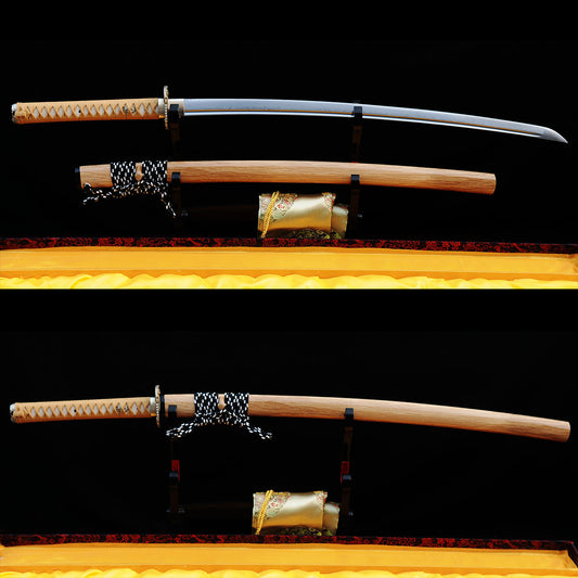 The Taka's Sky Katana, shown both unsheathed (displaying the folded 1095 steel blade) and sheathed (in its natural hardwood saya).