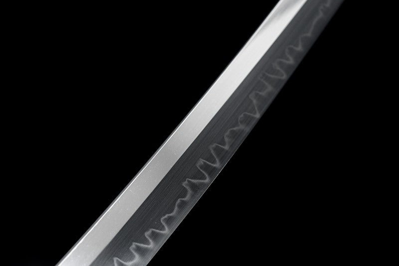 A full view of the T10 steel blade, displaying the entire length of the real clay-tempered hamon.