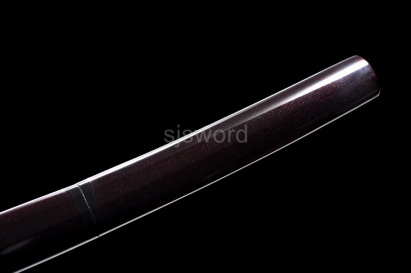 A full view of the hardwood saya with its burgundy red speckled lacquer finish.