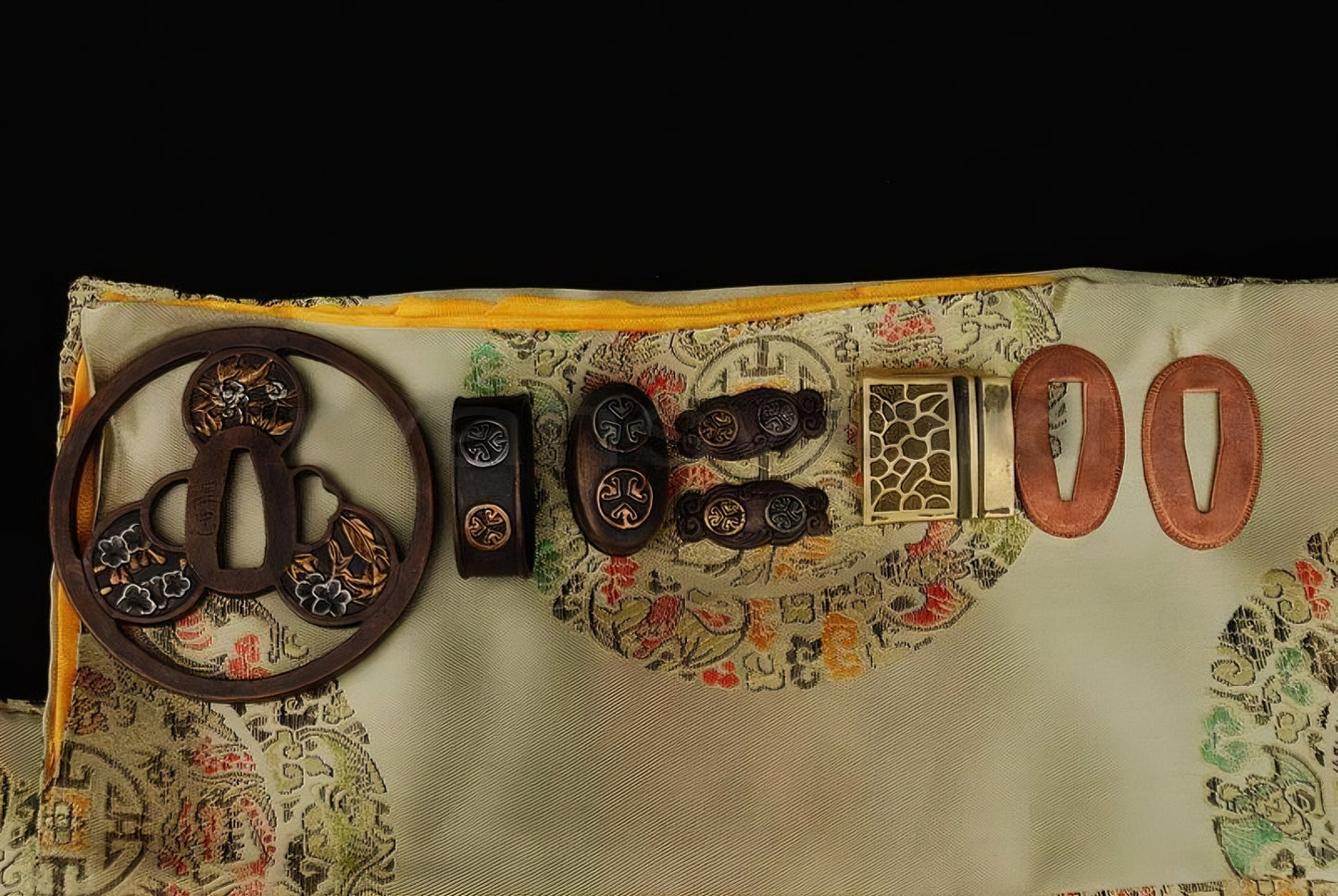 An alternate top-down view of the antique copper fittings with gilded accents, featuring the "Mitsudomoe" crest and other floral motifs.