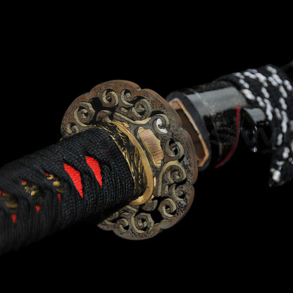 A detailed close-up of the "Great Wave" theme brass tsuba and the striking red genuine rayskin handle.