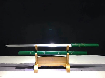The Green Phantom Bamboo Blade, unsheathed on a display stand, showing its high carbon steel straight blade and green bamboo-style saya.