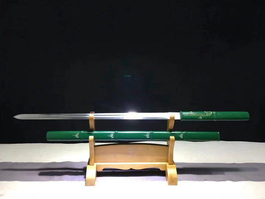 The Green Phantom Bamboo Blade, unsheathed on a display stand, showing its high carbon steel straight blade and green bamboo-style saya.