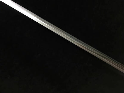 A full-length view of the hand-forged Honsanmai blade, displaying the bo-hi (groove) and its curvature.