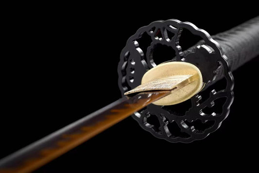 A close-up of the iron tsuba from the "Demon Slayer" Hinokami katana replica.