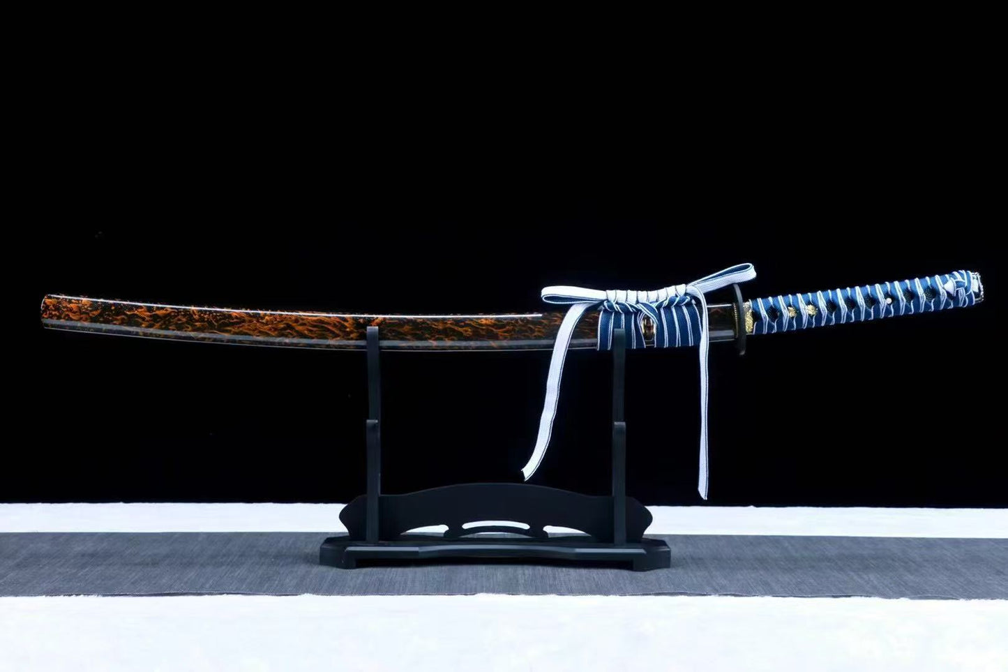 An alternate angle of the sheathed Azure Dragon Katana, highlighting the blue & white sageo cord.