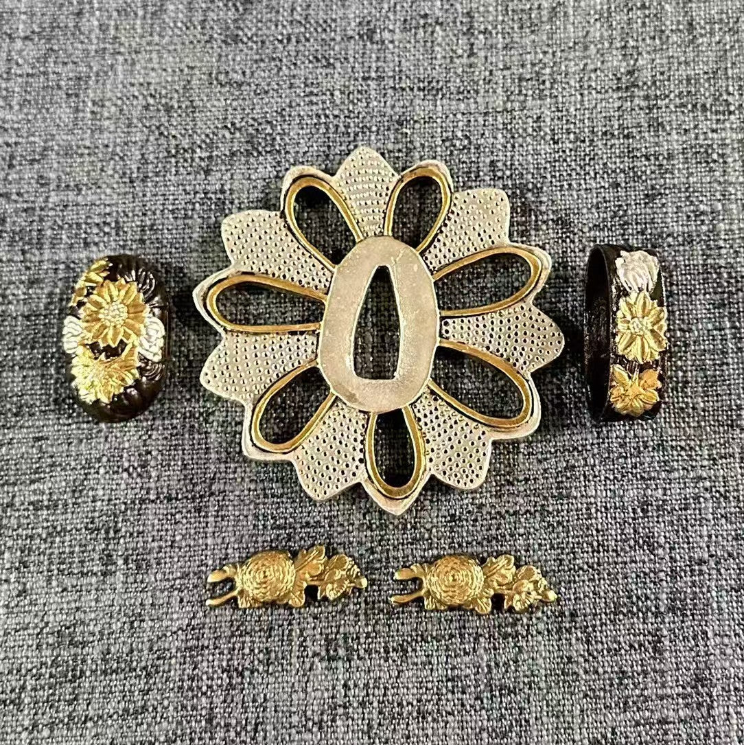 Complete Koshirae set with a Kiku (Chrysanthemum) theme, featuring a Gilded and Silvered Sukashi Tsuba, and matching Fuchi, Kashira, and Menuki.