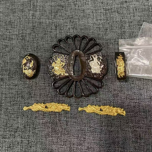 Complete Koshirae set featuring a Kiku-gata (chrysanthemum-shape) Sukashi Tsuba, adorned with gold and silver gilded dragons, and matching Fuchi, Kashira, and Menuki.
