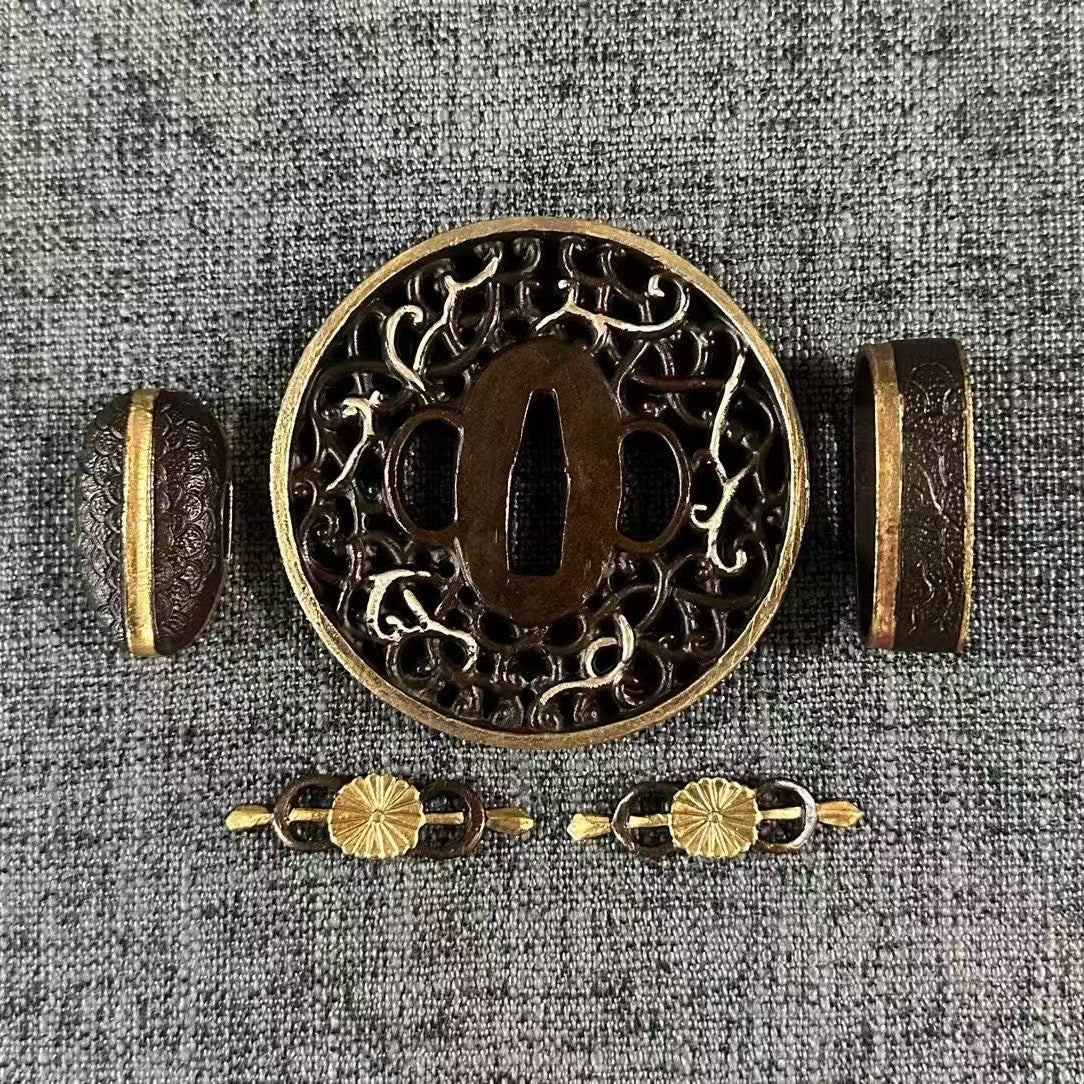 Gilded and silvered Koshirae set featuring a Kiku (Chrysanthemum) Menuki and a Karakusa (vine scroll) Sukashi Tsuba.