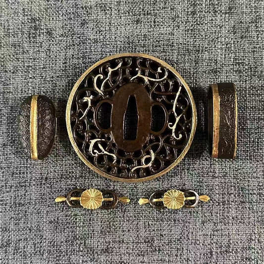 Gilded and silvered Koshirae set featuring a Kiku (Chrysanthemum) Menuki and a Karakusa (vine scroll) Sukashi Tsuba.