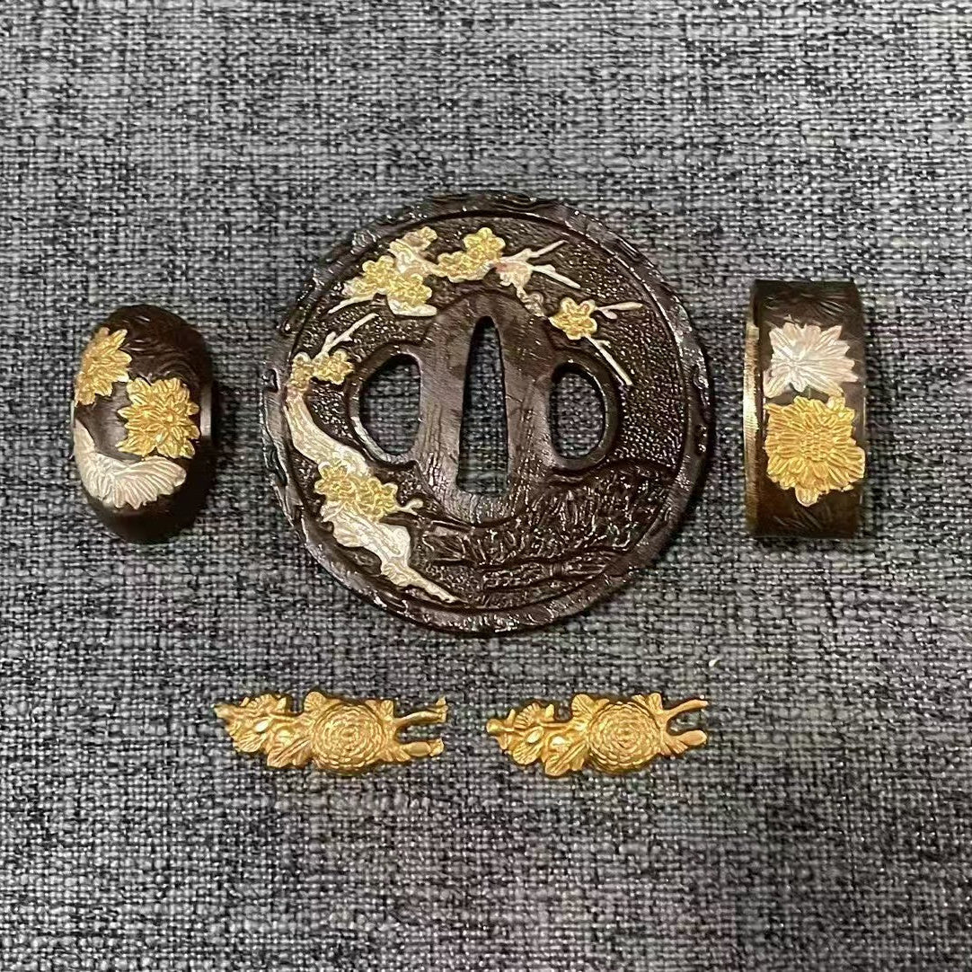 Complete Koshirae set featuring a "Kiku on the Vine" (Chrysanthemum) theme, with gold and silver gilded flowers on a textured black brass base.