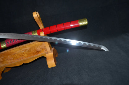 Close-up of the Sandai Kitetsu blade near the kissaki, showing the continuous wavy clay-tempered hamon along the polished edge.