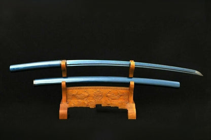 The Aurora Steel Blue Shirasaya with its metallic blue speckled lacquer finish, resting on a display stand.