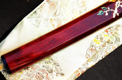 The Raden Ryū Katana's mother-of-pearl inlay saya displayed alongside its included silk sword bag.