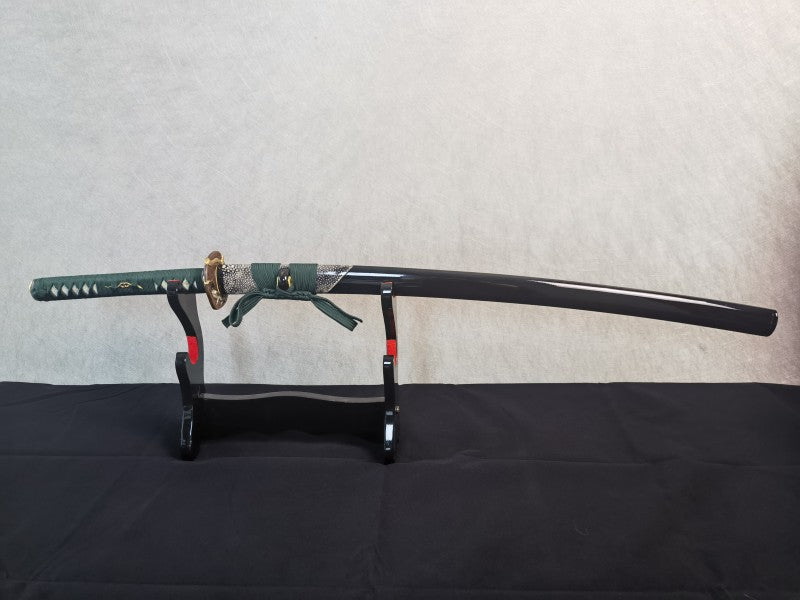 The complete Jade Serpent Katana, sheathed in its gloss-black saya featuring a half-wrap of white rayskin.