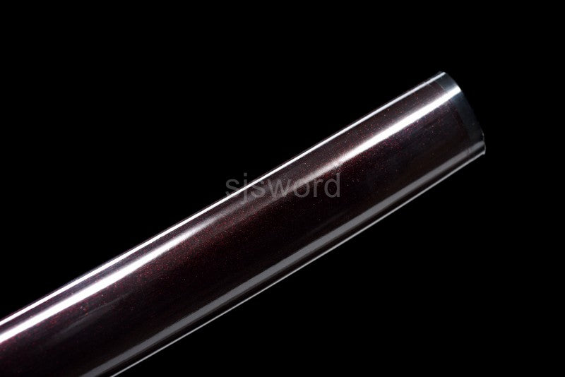 The Aurora Steel Red Shirasaya partially drawn, revealing the red folded steel blade from the hardwood saya.