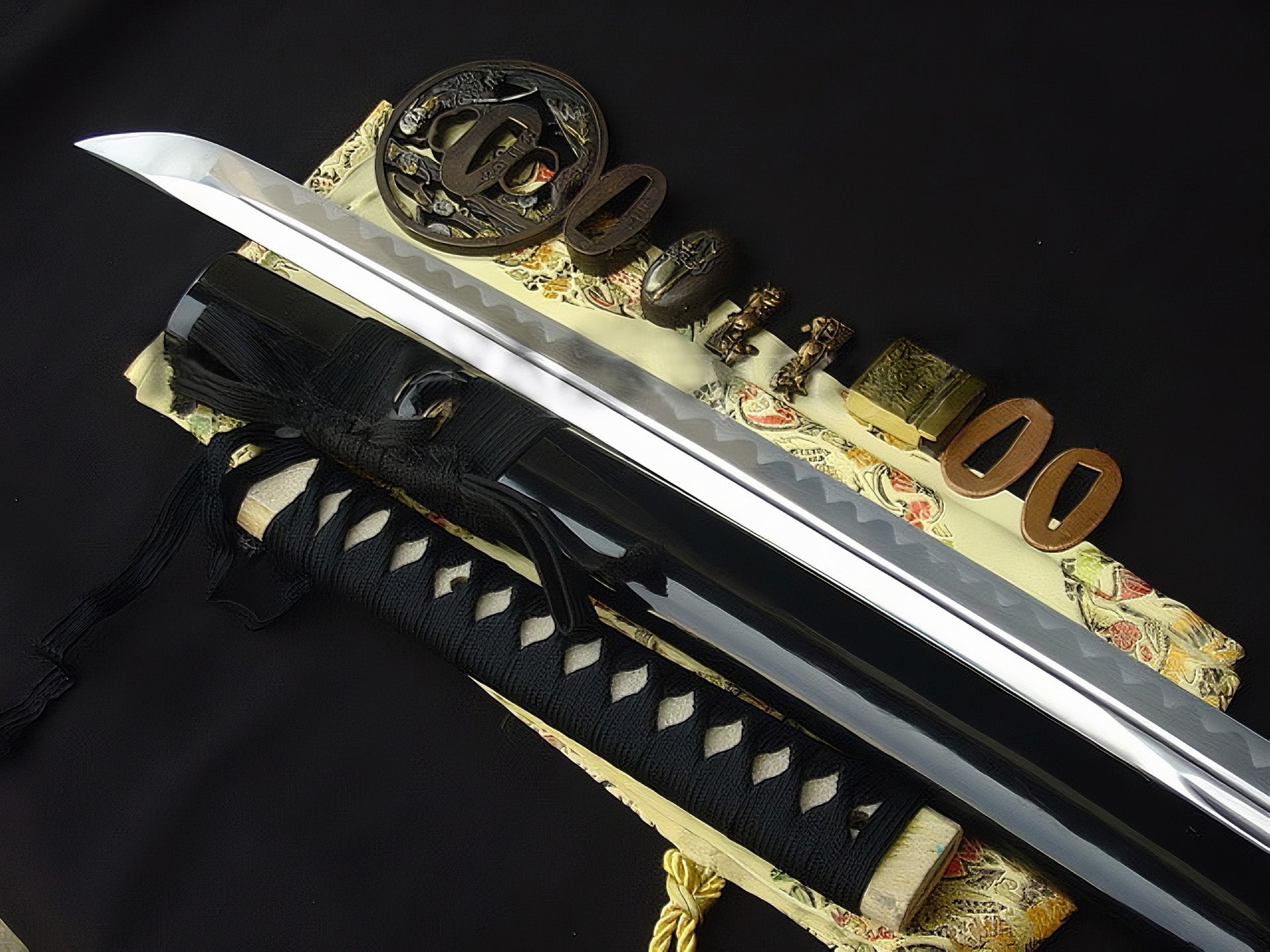 An alternate angle of the tsuka and tsuba, highlighting the "Sage's Journey" theme on the gilded and silvered brass.