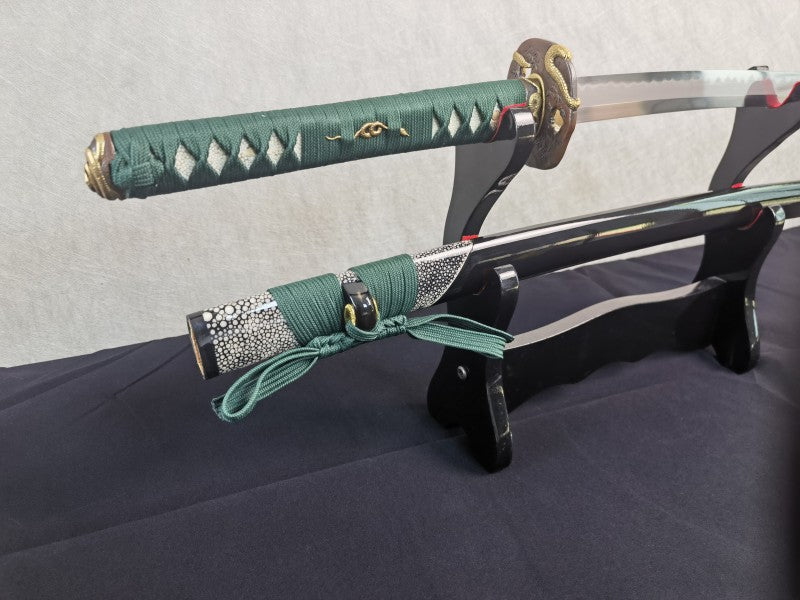 An alternate angle of the brass serpent tsuba and the green silk-wrapped handle of the Jade Serpent Katana.
