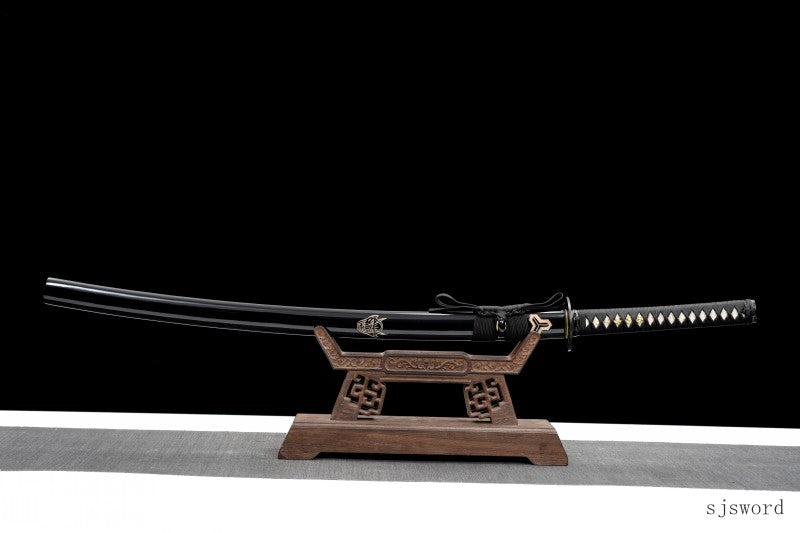 A full-length view of the sheathed Hattori Hanzō katana on its display stand.
