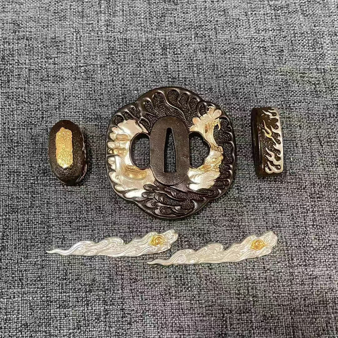 Complete Koshirae set featuring a large silvered dragon motif on a blackened brass Tsuba, with matching Fuchi, Kashira, and Menuki.